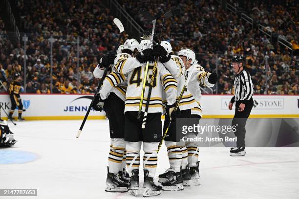 Pavel Zacha of the Boston Bruins celebrates with teammates after scoring a goal in the second period during the game against the Pittsburgh Penguins...