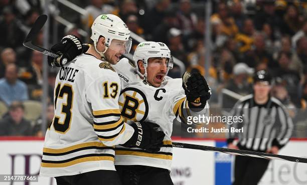 Brad Marchand of the Boston Bruins celebrates with Charlie Coyle after scoring a a short-handed goal in the second period during the game against the...