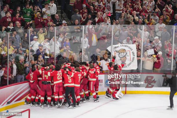 Denver Pioneers celebrate after defeating the Boston College at the Division I Men's Ice Hockey Championship held at Xcel Energy Center on April 13,...