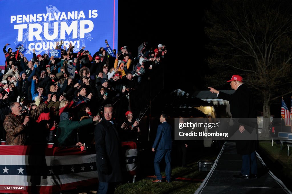 Trump Rally Backdrop Former US President Donald Trump gestures during a campaign rally at ...