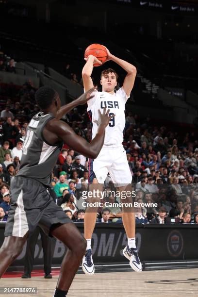 Cooper Flagg of Team USA shoots a three point basket against Team World during the 2024 Nike Hoop Summit on April 13, 2024 at the Moda Center Arena...