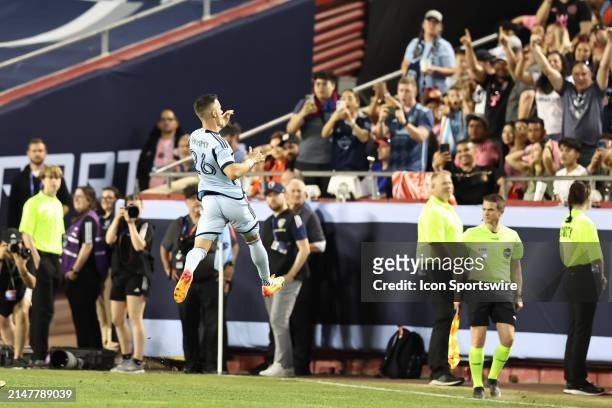 Sporting Kansas City midfielder Erik Thommy leaps towards the fans to celebrate a goal in the second half of an MLS match between Inter Miami CF and...