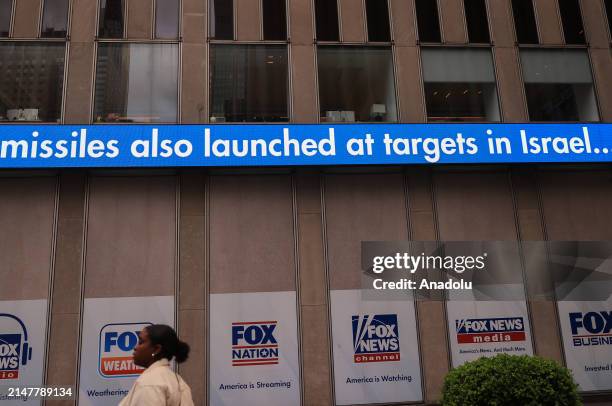 Fox News television channel, a US media outlet, announces Iran's retaliation attack on Israel as a 'breaking news' around the building in New York,...