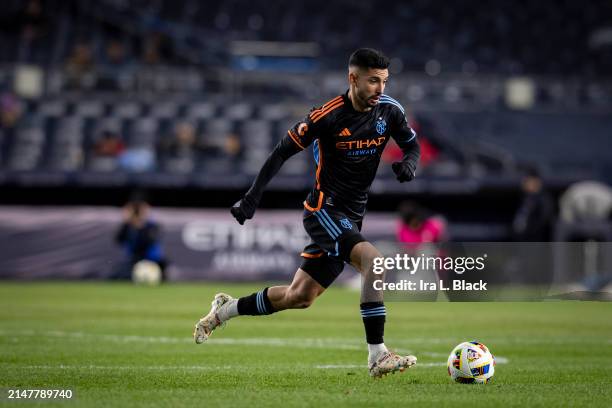 Santiago Rodríguez of New York City drives the ball down the pitch in the first half of the Major League Soccer match against the New England...