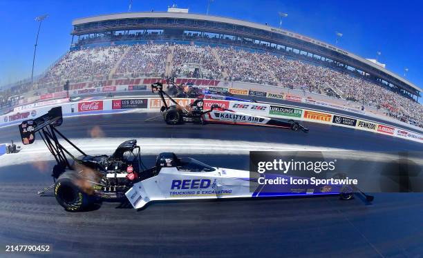 Top Fuel drivers, from bottom, Shawn Reed, Shawn Langdon, Antron Brown and Steve Torrence head down track during the semi final round of the Mission...