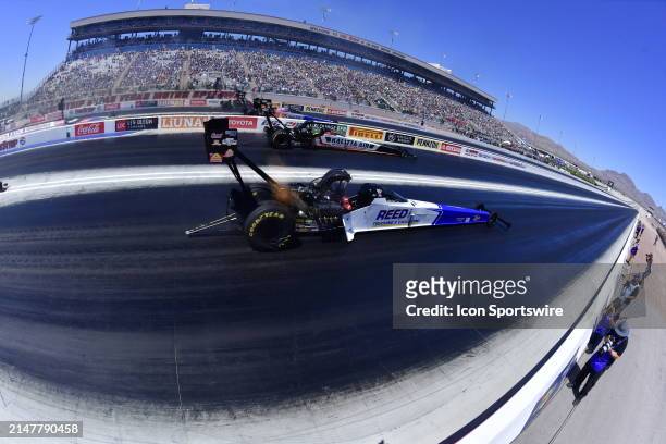 Top Fuel drivers, from bottom, Shawn Reed, Shawn Langdon, Antron Brown and Steve Torrence head down track during the semi final round of the Mission...