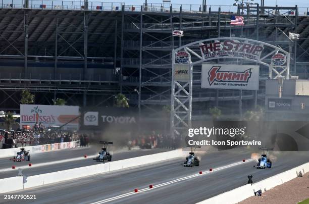 Top Fuel drivers, from left, Steve Torrence, Jasmine Salinas, Brittany Force and Tony Schumacher head down track during the final round of qualifying...