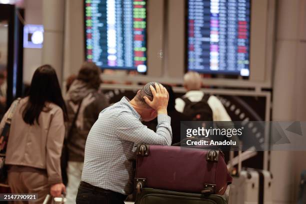 Passengers wait following Israel closed its airspace to all domestic and international flights between 01.00-07.00 a.m. Were canceled after Iran...