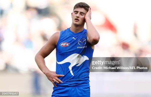 Harry Sheezel of the Kangaroos looks dejected after a loss during the 2024 AFL Round 05 match between the Geelong Cats and the North Melbourne...