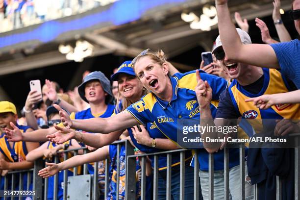 Fans celebrate win with the fans during the 2024 AFL Round 05 match between the West Coast Eagles and the Richmond Tigers at Optus Stadium on April...