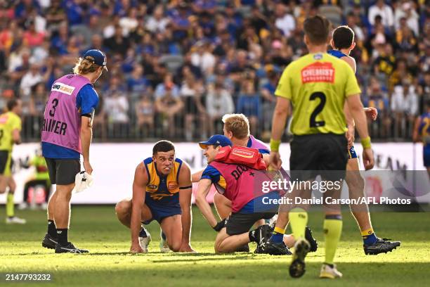 Jake Waterman of the Eagles is seen injured during the 2024 AFL Round 05 match between the West Coast Eagles and the Richmond Tigers at Optus Stadium...