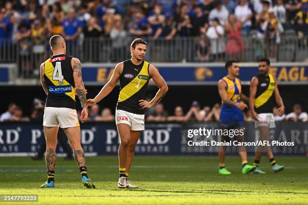 Dustin Martin and Daniel Rioli of the Tigers are upset after the loss during the 2024 AFL Round 05 match between the West Coast Eagles and the...