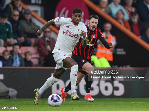 Manchester United's Marcus Rashford under pressure from Bournemouth's Adam Smith during the Premier League match between AFC Bournemouth and...