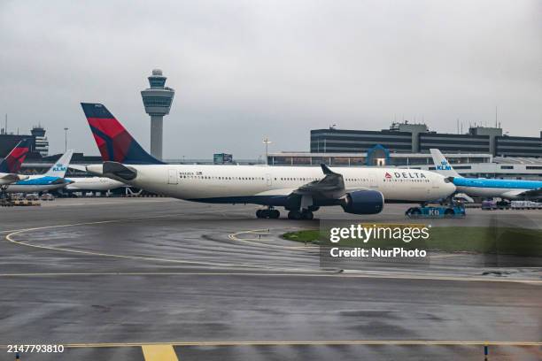 Delta Air Lines Airbus A330-900neo wide body passenger aircraft spotted while towed in Amsterdam Schiphol Airport AMS EHAM with the air traffic...