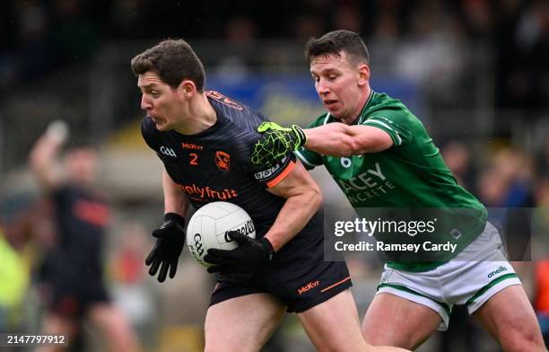 Fermanagh , United Kingdom - 14 April 2024; Paddy Burns of Armagh in action against Shane McGullion of Fermanagh during the Ulster GAA Football...