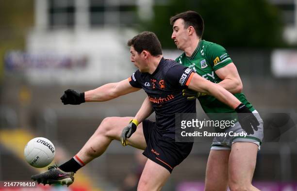 Fermanagh , United Kingdom - 14 April 2024; Paddy Burns of Armagh in action against Garvan Jones of Fermanagh during the Ulster GAA Football Senior...