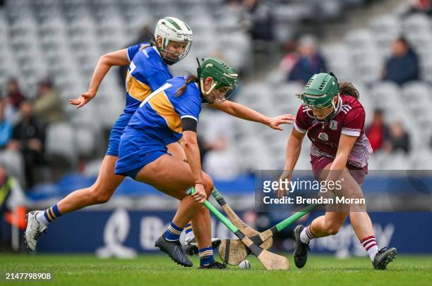 Dublin , Ireland - 14 April 2024; Niamh McPeake of Galway in action against Clodagh McIntyre and Caoimhe Maher of Tipperary during the Very Camogie...