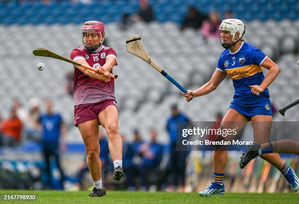 Dublin , Ireland - 14 April 2024; Orlaith McGrath of Galway is hooked by Mairead Eviston of Tipperary during the Very Camogie League Division 1A...