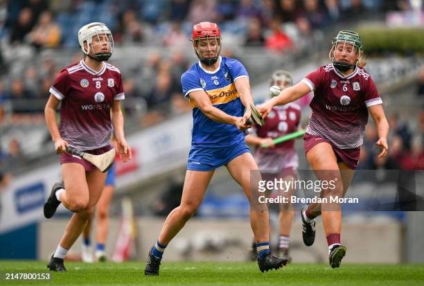 Dublin , Ireland - 14 April 2024; Karen Kennedy of Tipperary in action against Ally Hesnan, left, and Áine Keane of Galway during the Very Camogie...