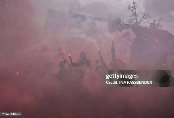 Fans of Bayer Leverkusen celebrate with flares ahead the German first division Bundesliga football match Bayer 04 Leverkusen v Werder Bremen in...