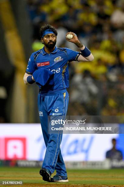 Mumbai Indians' captain Hardik Pandya catches the ball during the Indian Premier League Twenty20 cricket match between Mumbai Indians and Chennai...