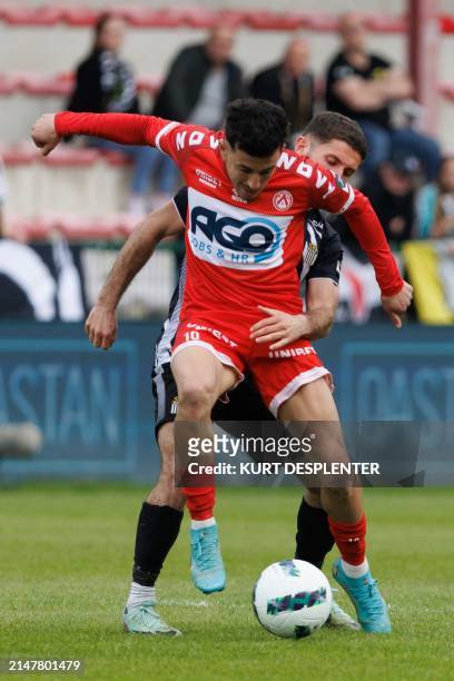 Kortrijk's Abdelkahar Kadri and Charleroi's Antoine Bernier fight for the ball during a soccer match between KV Kortrijk and Sporting Charleroi,...