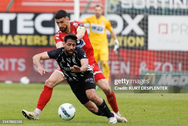 Kortrijk's Joao Silva Eira Antunes and Charleroi's Vetle Dragsnes fight for the ball during a soccer match between KV Kortrijk and Sporting...