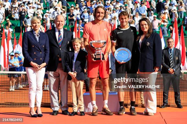 First placed Greece's Stefanos Tsitsipas and second placed Norway's Casper Ruud celebrate with their trophies posing with Princess Charlene of Monaco...