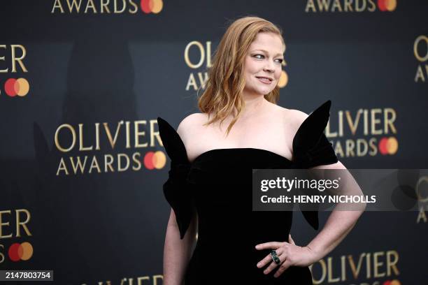 Australian actor Sarah Snook poses on the green carpet upon arrival to attend The Olivier Awards at the Royal Albert Hall in central London on April...