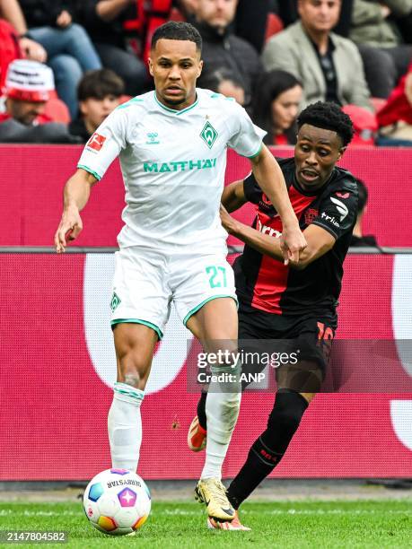 Felix Agu of SV Werder Bremen, Nathan Tella of Bayer 04 Leverkusen during the Bundesliga match between Bayer 04 Leverkusen and Werder Bremen at the...