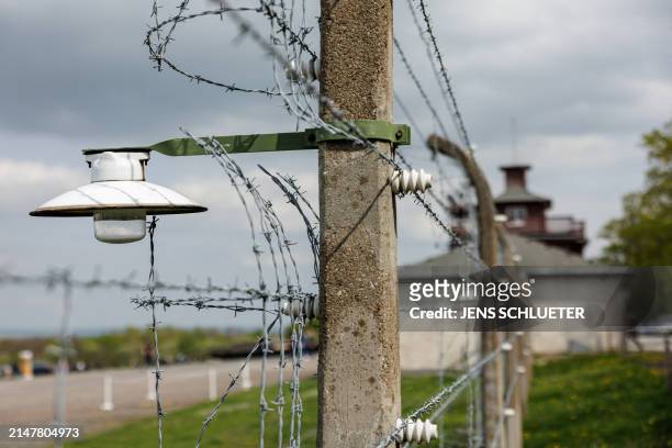 Barbed wire fence encloses the memorial site of the former Nazi concentration camp Buchenwald prior to the commemoration ceremony to mark the 79th...
