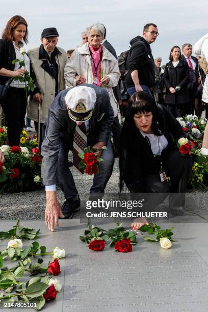 Holocaust survivors and relatives pay their respects to victims as they place wreaths during the commemoration ceremony to mark the 79th anniversary...
