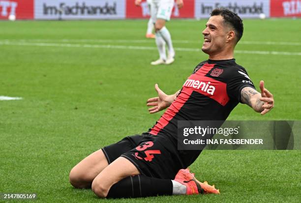 Bayer Leverkusen's Swiss midfielder Granit Xhaka celebrates scoring the 2-0 goal during the German first division Bundesliga football match Bayer 04...