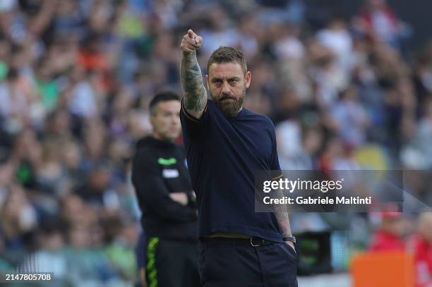 Daniele De Rossi manager of AS Roma gestures during the Serie A TIM match between Udinese Calcio and AS Roma at Dacia Arena on April 14, 2024 in...