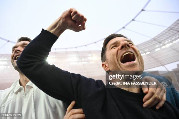 Bayer Leverkusen's Spanish head coach Xabi Alonso celebrates after the German first division Bundesliga football match Bayer 04 Leverkusen v Werder...