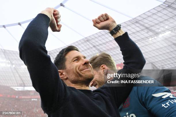 Bayer Leverkusen's Spanish head coach Xabi Alonso celebrates after the German first division Bundesliga football match Bayer 04 Leverkusen v Werder...