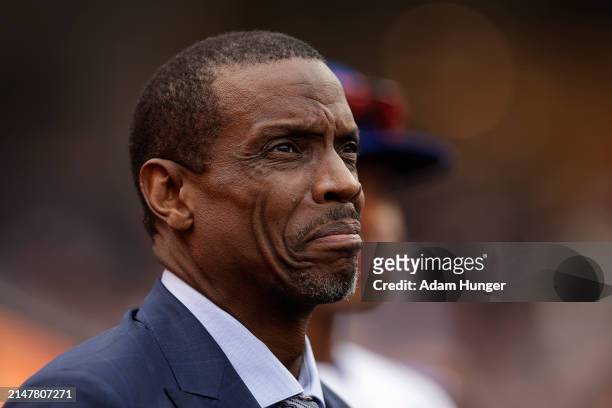 Dwight "Doc" Gooden reacts during a pregame ceremony to retire his jersey number by the New York Mets before a game against the Kansas City Royals at...