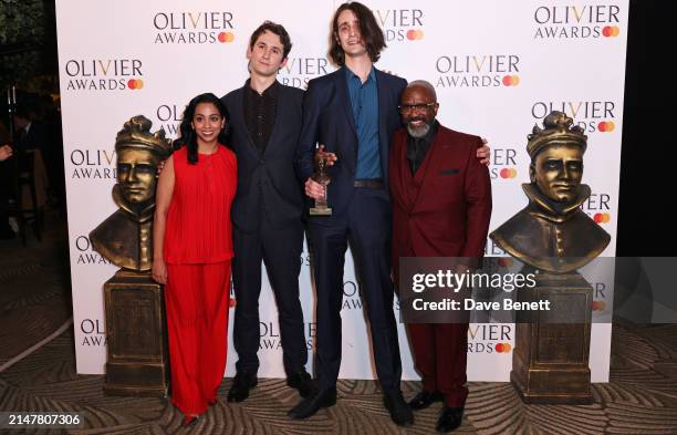 Presenters Anjana Vasan and Lucian Msamati pose with Orlando Phipps and Harrison Phipps, accepting the Best Actress in a Supporting Role award on...