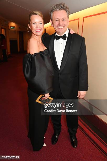 Anna Maxwell Martin and Michael Sheen pose backstage during The Olivier Awards 2024 at Royal Albert Hall on April 14, 2024 in London, England.