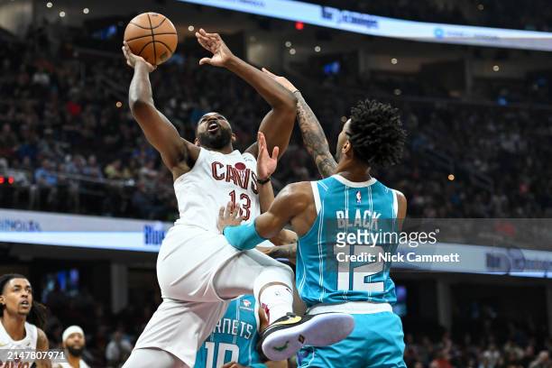 Tristan Thompson of the Cleveland Cavaliers shoots against Leaky Black of the Charlotte Hornets during the first half at Rocket Mortgage Fieldhouse...
