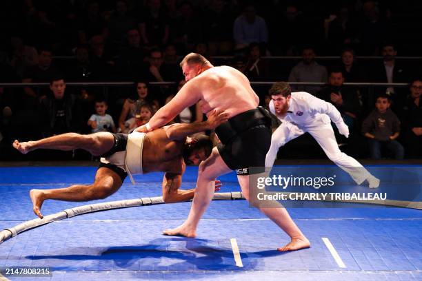 Sumo wrestlers Mohamed Kamal and Soslan Gagloev compete during a World Championship Sumo event at The Theater at Madison Square Garden in New York...