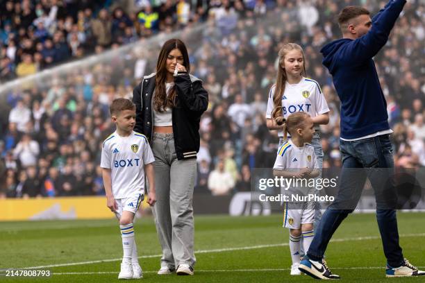 Stuart Dallas is walking the pitch with his family at halftime during the SkyBet Championship match between Leeds United and Blackburn Rovers at...