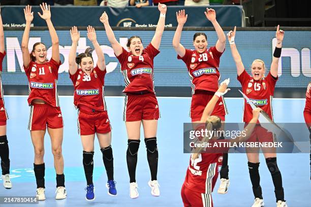 Hungarian team members celebrate their victory and their "Ticket to Paris 2024 Olympic Games" after the women's Handball Olympic qualifying match...