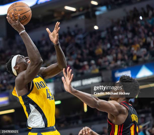 Pascal Siakam of the Indiana Pacers shoots the ball against De'Andre Hunter of the Atlanta Hawks during the second half at Gainbridge Fieldhouse on...