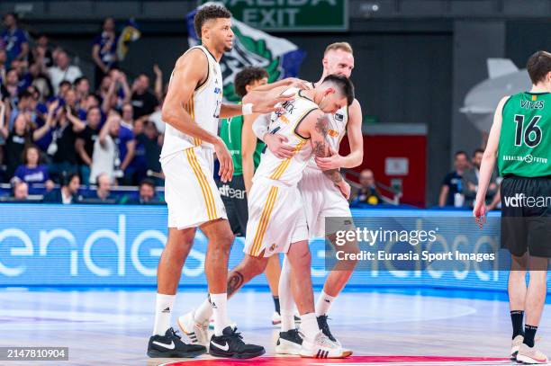 Gabriel Deck of Real Madrid hugs Dzanan Musa of Real Madrid with Edy Tavares of Real Madrid during ACB Liga Endesa Basketball match between Real...