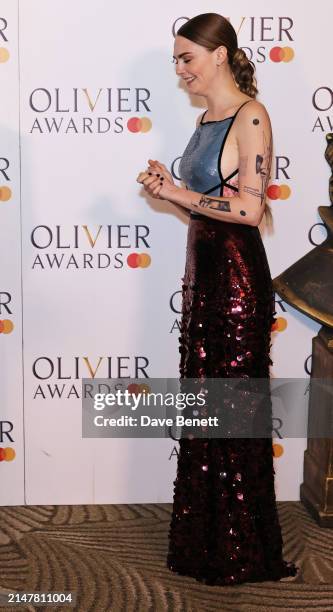 Cara Delevingne poses in the winners room at The Olivier Awards 2024 at Royal Albert Hall on April 14, 2024 in London, England.