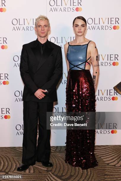 Luke Treadaway and Cara Delevingne pose in the winners room at The Olivier Awards 2024 at Royal Albert Hall on April 14, 2024 in London, England.