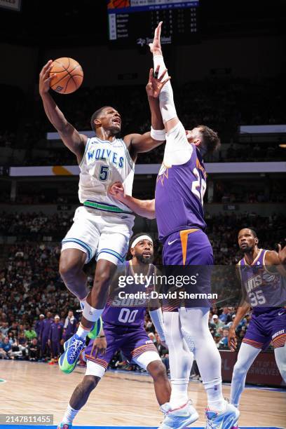 Anthony Edwards of the Minnesota Timberwolves drives to the basket during the game against the Phoenix Suns on April 14, 2024 at Target Center in...