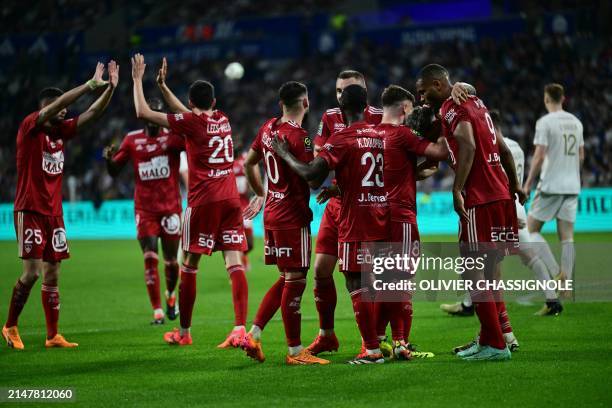 Brest's players celebrates after scoring a goal during the French L1 football match beetween Olympique Lyonnais and Stade Brestois 29 at the Groupama...