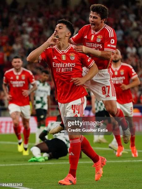 Tomas Araujo of SL Benfica celebrates with teammate Joao Neves of SL Benfica after scoring a goal during the Liga Portugal Betclic match between SL...